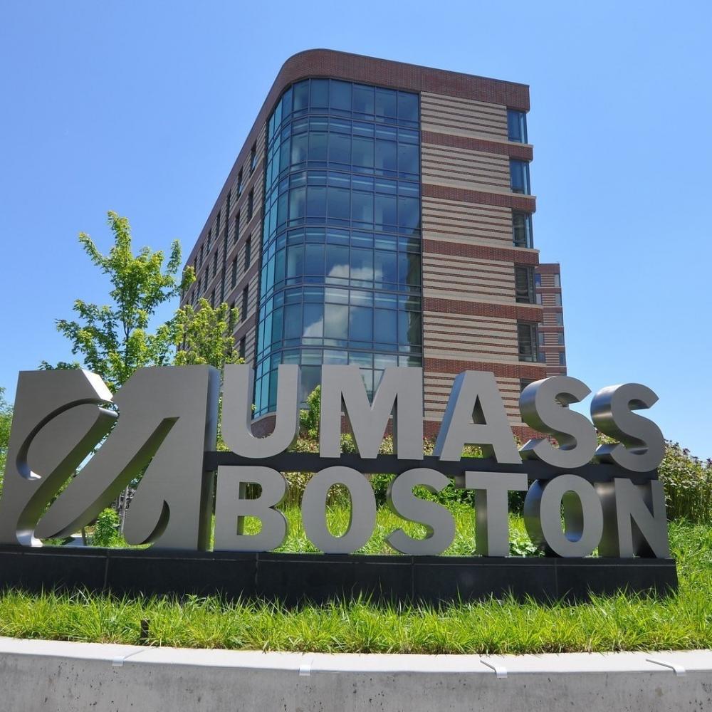 UMass Boston sign in front of the East residence hall