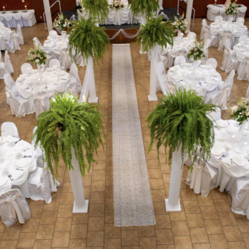 Charles Hayes Investment Center, Chicago. Elegant white wedding set up with reception tables around.
