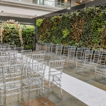 Sky Garden at Magnificent Mile - Rooftop deck area with lush greenery on walls and wedding ceremony set up.