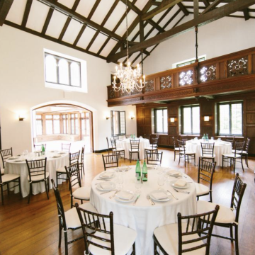 Interior image of Event Space with Vaulted Ceilings and Round Tables at Willowdale Estate